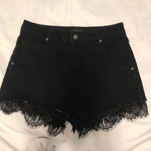 Black denim shorts with Lace hem